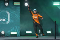 McLaren driver Lando Norris, of Britain, celebrates as he is introduced after winning the Formula One Miami Grand Prix auto race at the Miami International Autodrome, Sunday, May 5, 2024, in Miami Gardens, Fla. (AP Photo/Wilfredo Lee)