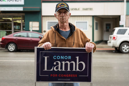 Neil Stewart, a Vietnam Veteran and support of Congressional candidate Conor Lamb, poses for a portrait along High Street in Waynesburg, Pennsylvania, U.S., February 14, 2018. Picture taken February 14, 2018. REUTERS/Maranie Staab