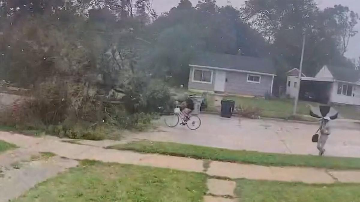 Video shows tree nearly hitting cyclist as extreme weather, temperatures hit Milwaukee