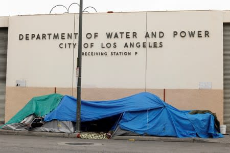 Tents and tarps erected by homeless people are shown along the sidewalks in the skid row area of downtown Los Angeles, California