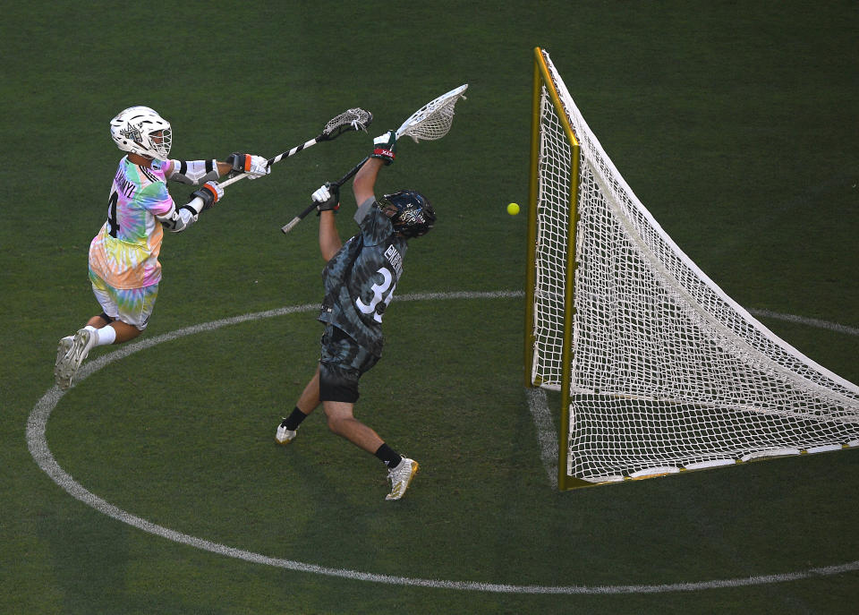 LOS ANGELES, CALIFORNIA - JULY 21:  Will Manny #4 of Team Baptiste scores a goal past Kyle Berniohr #35 of Team Rambo, for a 6-6 tie, during the Premier Lacrosse League all star game between Team Baptiste and Team Rambo at Banc of California Stadium on July 21, 2019 in Los Angeles, California. (Photo by Harry How/Getty Images)