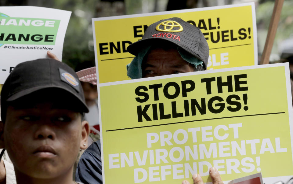 Environmental activists hold placards during a rally outside the Department of Environment and Natural Resources to coincide with the global protests on climate change Friday, Sept. 20, 2019 at suburban Quezon city, northeast of Manila, Philippines. Various environmental groups in the country are participating in what is expected to be the world's largest mobilization on climate change known as "Global Climate Strikes."(AP Photo/Bullit Marquez)