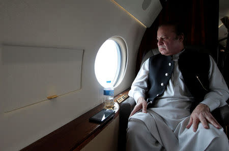 Pakistani Prime Minister Nawaz Sharif looks out the window of his plane after attending a ceremony to inaugurate the M9 motorway between Karachi and Hyderabad, Pakistan February 3, 2017. REUTERS/Caren Firouz