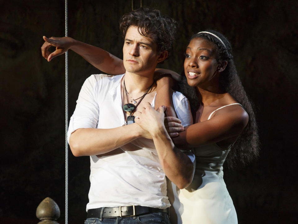 This theater image released by The Hartman Group shows Orlando Bloom, left, and Condola Rashad during a performance of "Romeo and Juliet," in New York. Content provider Screenvision and the new company BroadwayHD have teamed up to broadcast the recent Orlando Bloom-led production of “Romeo and Juliet” to movie theaters across the country. It marked the first time in over 36 years “Romeo and Juliet” had been on Broadway. (AP Photo/The Hartman Group, Carol Rosegg)