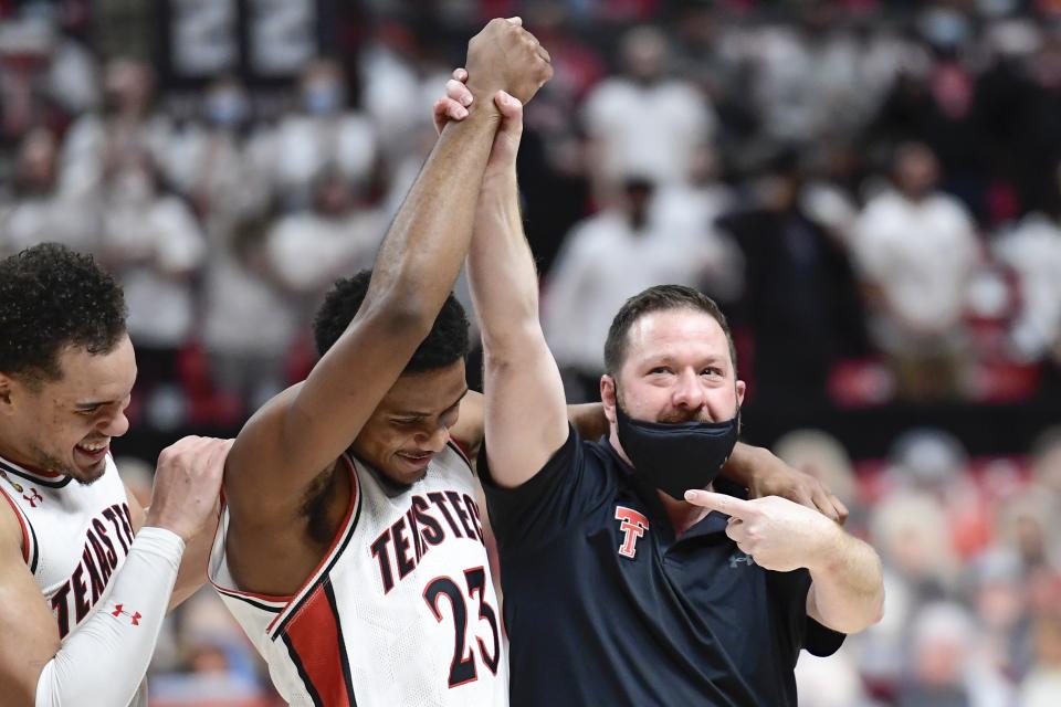 Texas Tech head coach Chris Beard points to Chibuzo Agbo (23) after an NCAA college basketball game against Texas in Lubbock, Texas, Saturday, Feb. 27, 2021. (AP Photo/Justin Rex)