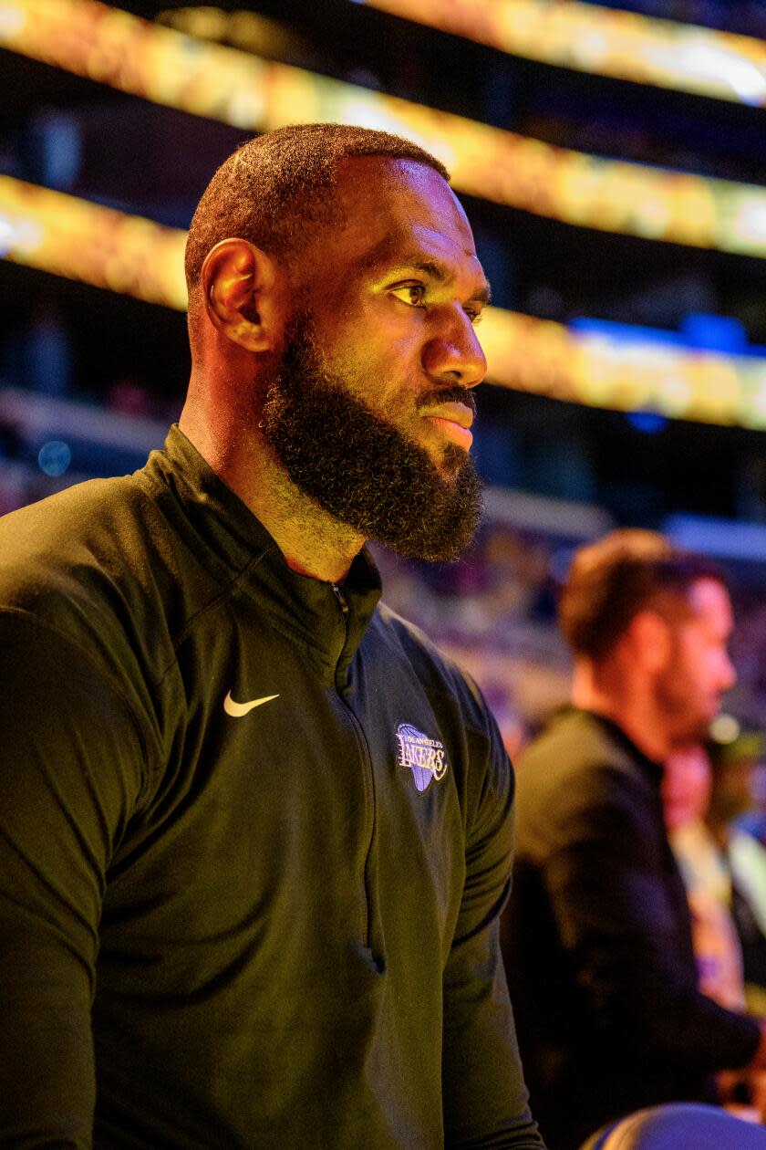 LeBron James, left, and Bronny James will be the first father-son duo to ever play in the NBA at the same time.