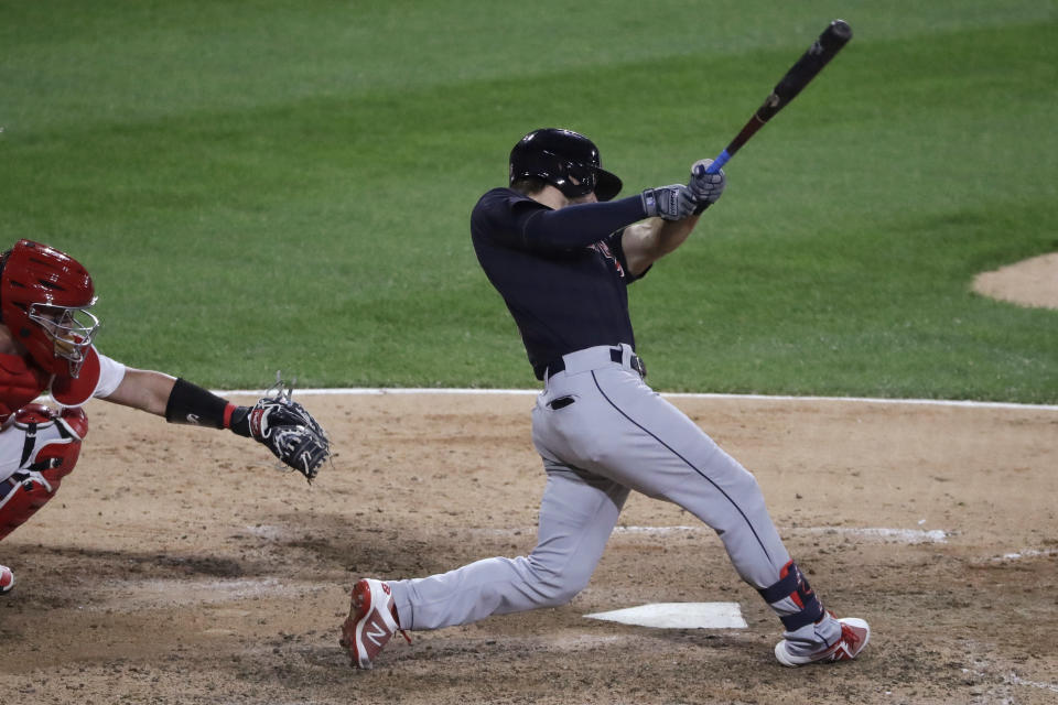 Cleveland Indians' Mike Freeman hits an RBI single against the Chicago White Sox during the 10th inning of a baseball game in Chicago, Sunday, Aug. 9, 2020. (AP Photo/Nam Y. Huh)