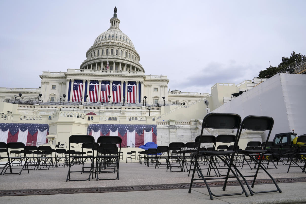 Chairs are positioned socially distanced from each other as preparations take place for President-elect Joe Biden's inauguration ceremony at the U.S. Capitol in Washington, Saturday, Jan. 16, 2021. (AP Photo/Patrick Semansky)