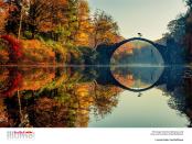 Masterpiece by Yodobashi: Lorenz Holder, Germany showing Senad Grosic ride his bike over a bridge in an autumnal Gablenz, Germany. (© Lorenz Holder / Red Bull Illume)