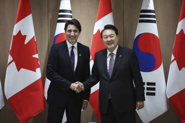 Canada's Prime Minister Justin Trudeau, left, and South Korea's President Yoon Suk Yeol shake hands during their meeting at the Presidential Office in Seoul, South Korea, Wednesday, May 17, 2023. (Kim Hong-Ji/Pool Photo via AP)