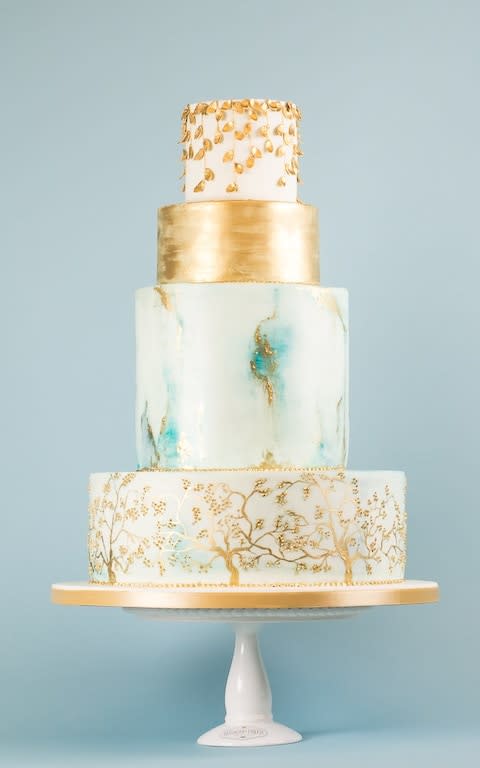 Marbled four tier cake with hand piped gold details - Credit: Rosalind Miller/Rosalind Miller