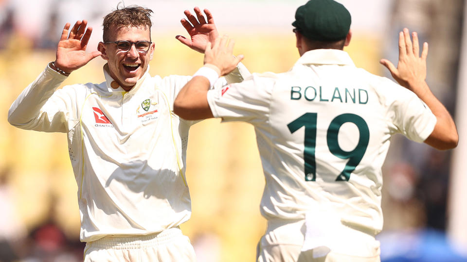 Todd Murphy, left, celebrates a wicket with Australian teammate Scott Boland.