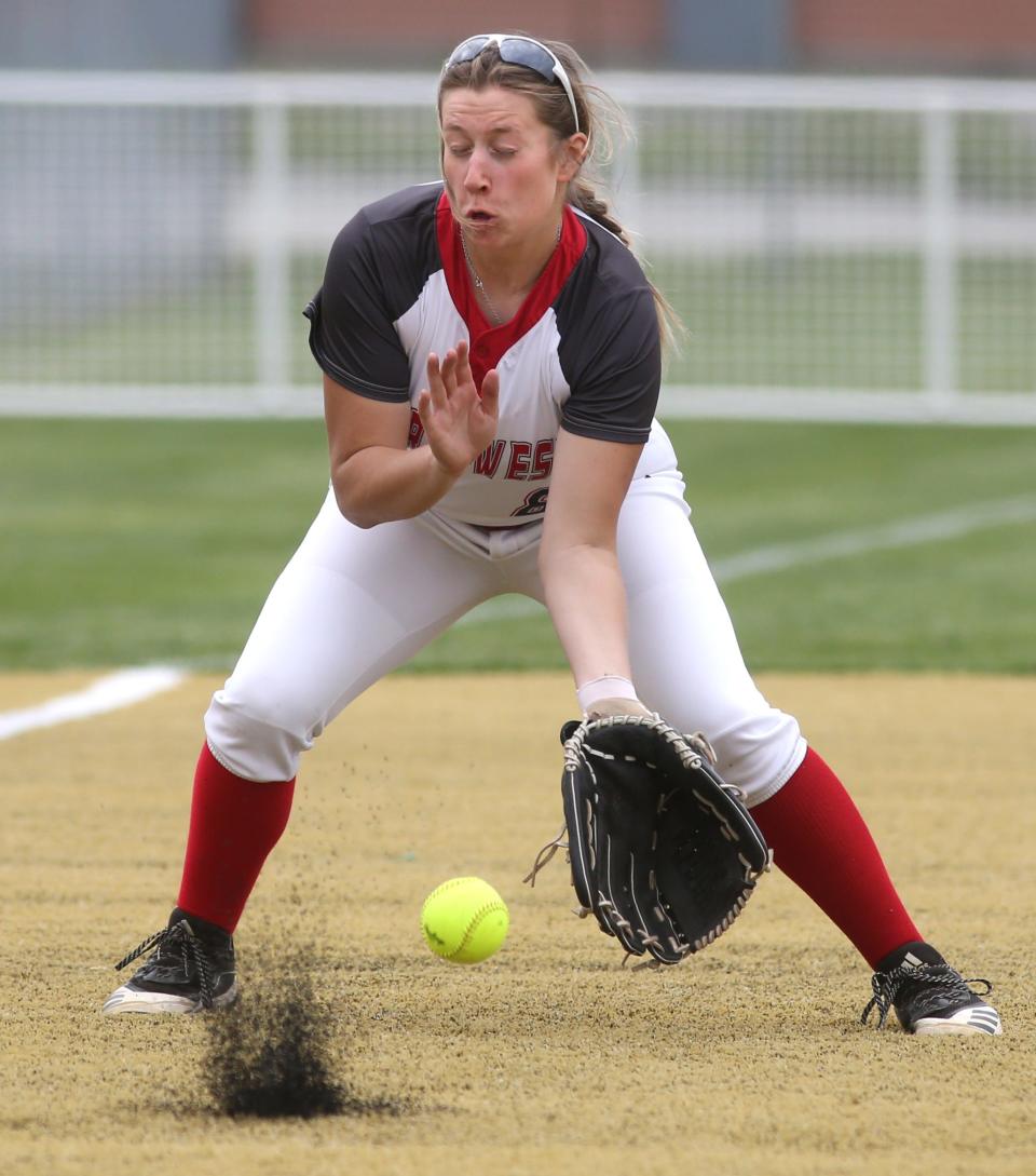 Northwest third baseman Caroline Metzger fields a grounder, May 16, 2023 in a Canton Division II district semifinal.