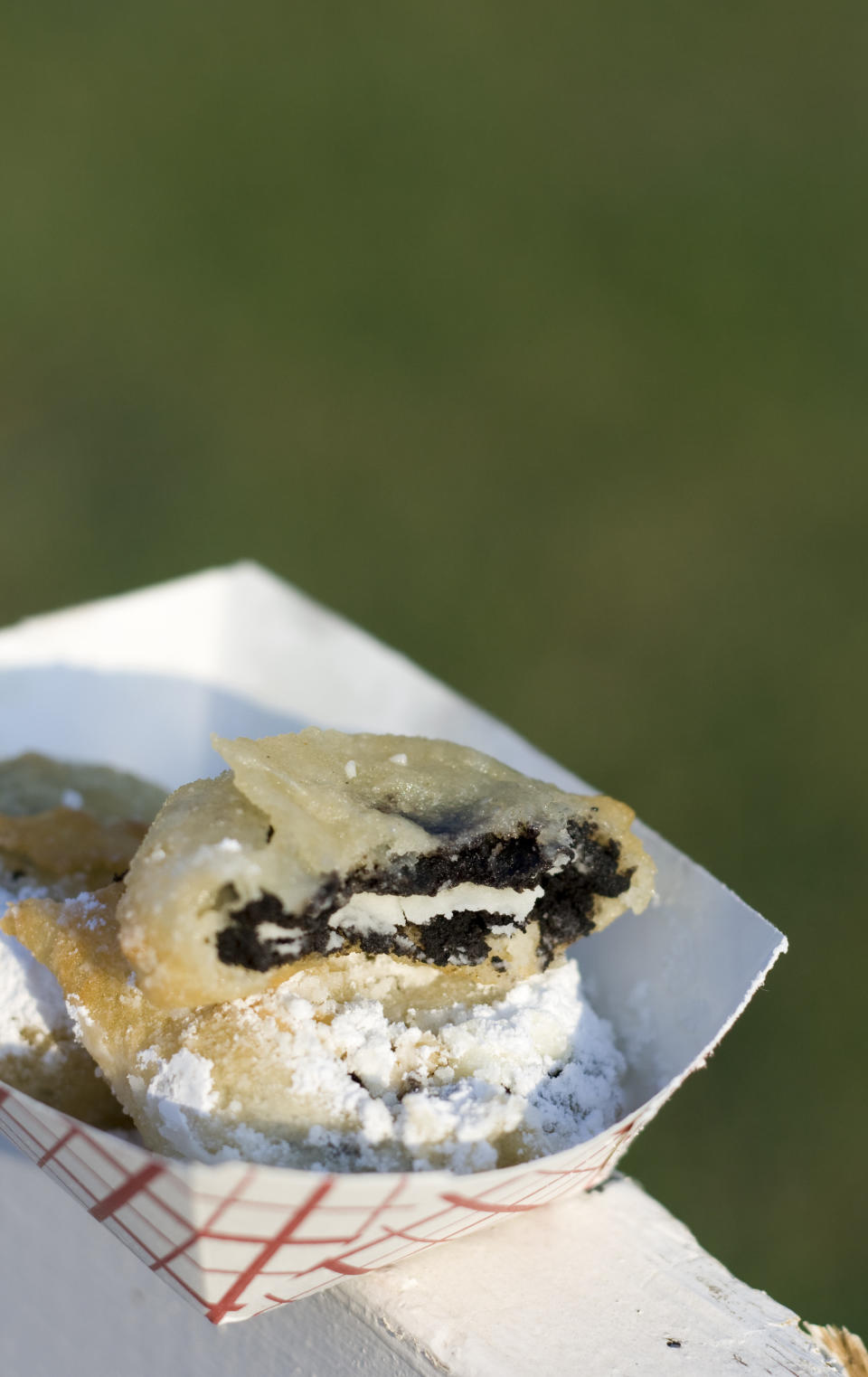 Fried Oreos covered in powdered sugar.