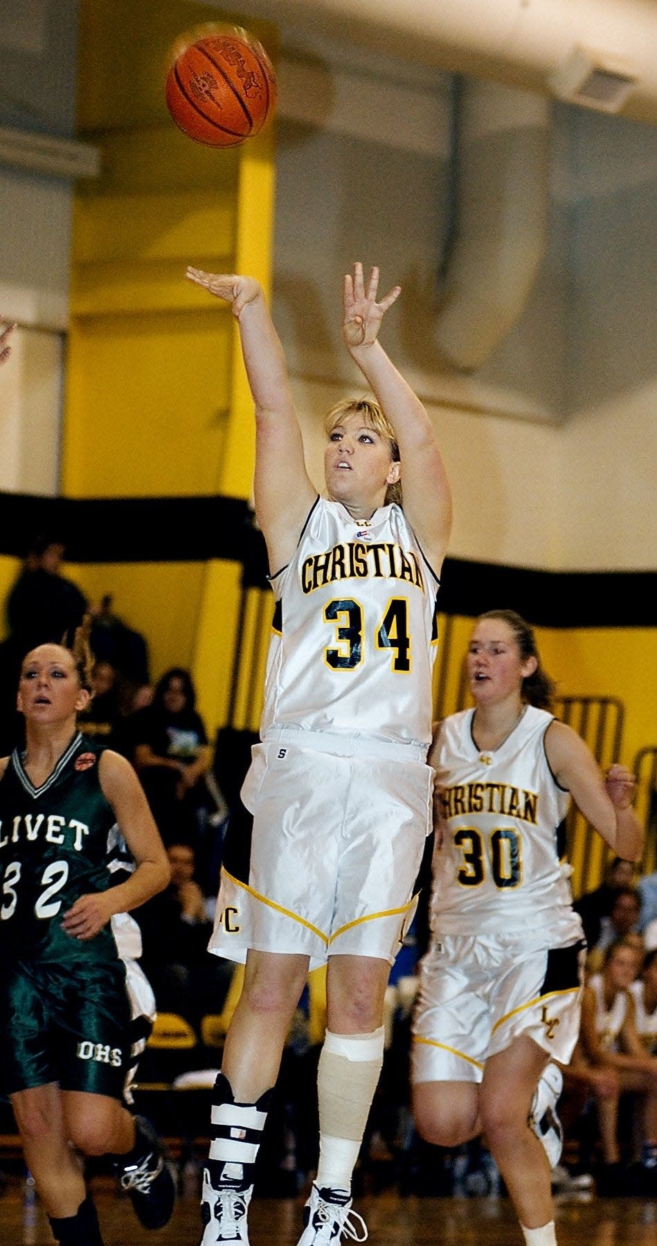 Tiffanie Shives of Lansing Christian shoots an uncontested 3-point shot during a game against Olivet in 2004.