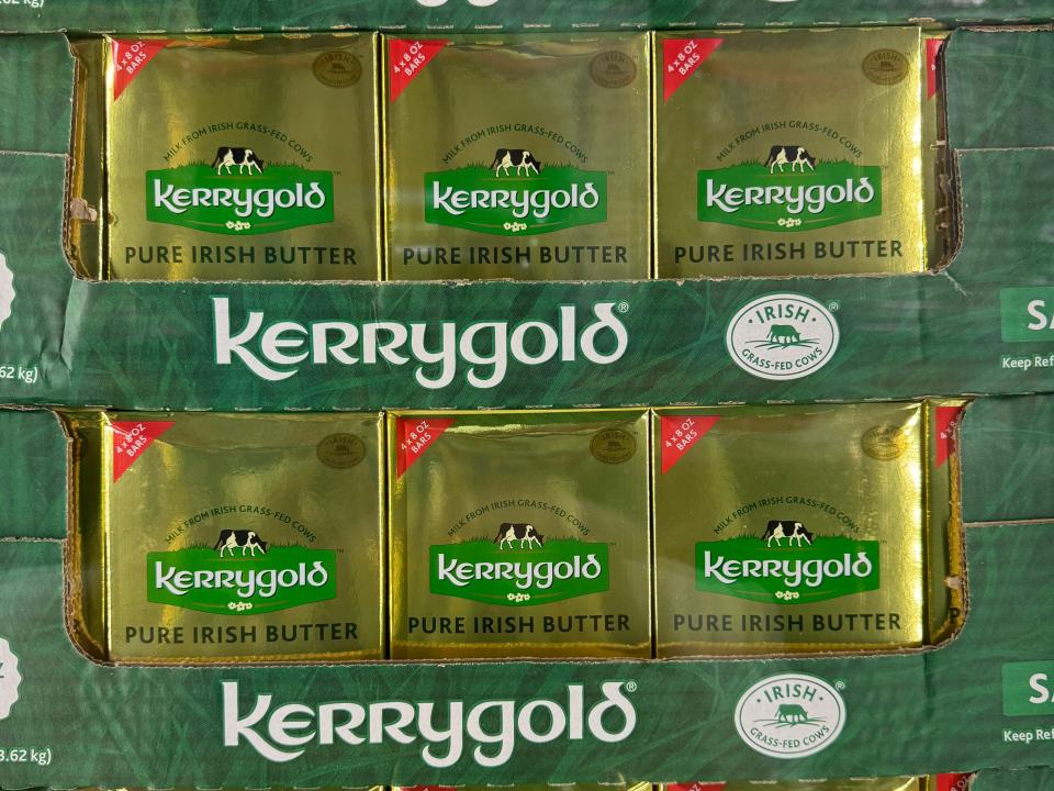 Large blocks of Kerrygold gold-wrapped butter on display at a Costco