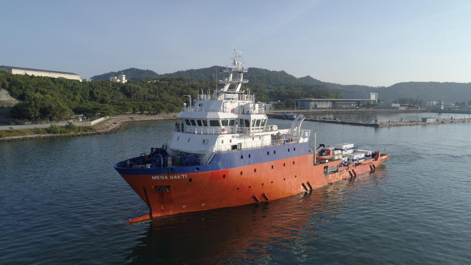 A ship carrying members of the Royal Malaysian Navy departs to join the search mission of the missing Indonesia's submarine KRI Nanggala-402.