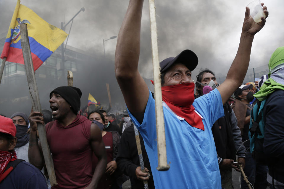 Anti-government protesters, including indigenous people, clash with police near the National Assembly in Quito, Ecuador, Tuesday, Oct. 8, 2019. Anti-government protests, which began when President Lenín Moreno’s decision to cut subsidies led to a sharp increase in fuel prices, has persisted for days and clashes led the president to move his besieged administration out of Quito. (AP Photo/Dolores Ochoa)