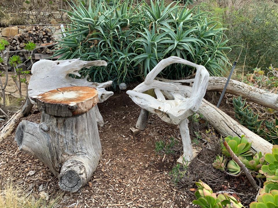 Fiona Chandra, chairs and tables made from tree trunks and branches, "I paid $412 to Stay in a Hobbit House."