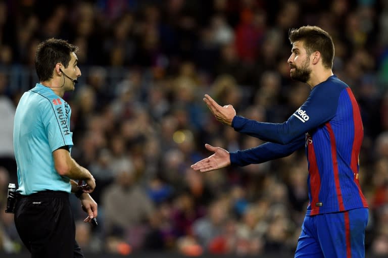 Barcelona's defender Gerard Pique (R) Pique is Barca's best defender, leader, possible future president and principal provocateur to the Madrid fans and media