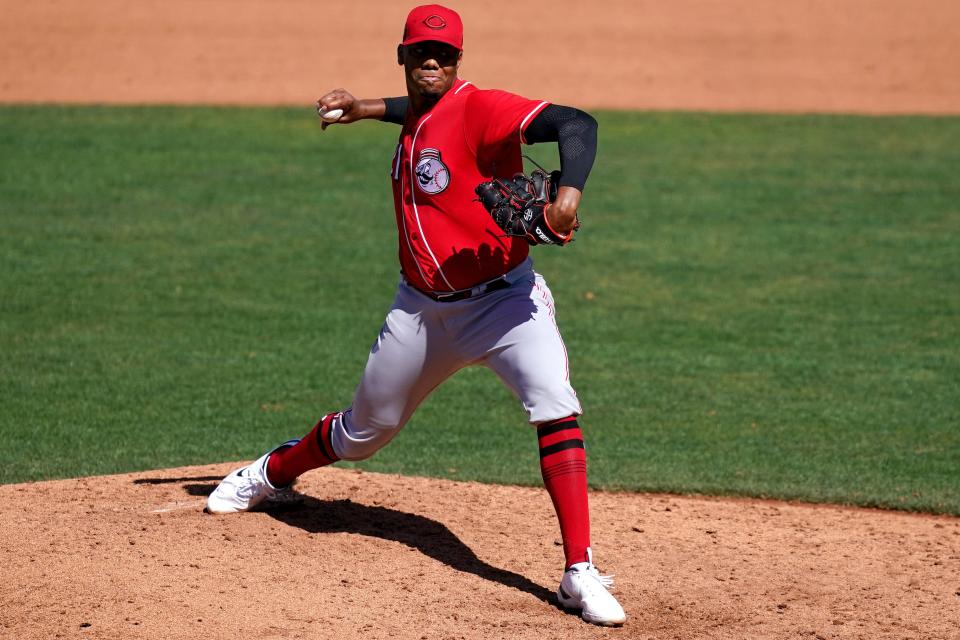 Cincinnati Reds pitcher Hunter Greene (21) delivers during a spring training game against the Chicago Cubs, Monday, March 21, 2022, at Sloan Park in Mesa, Ariz.