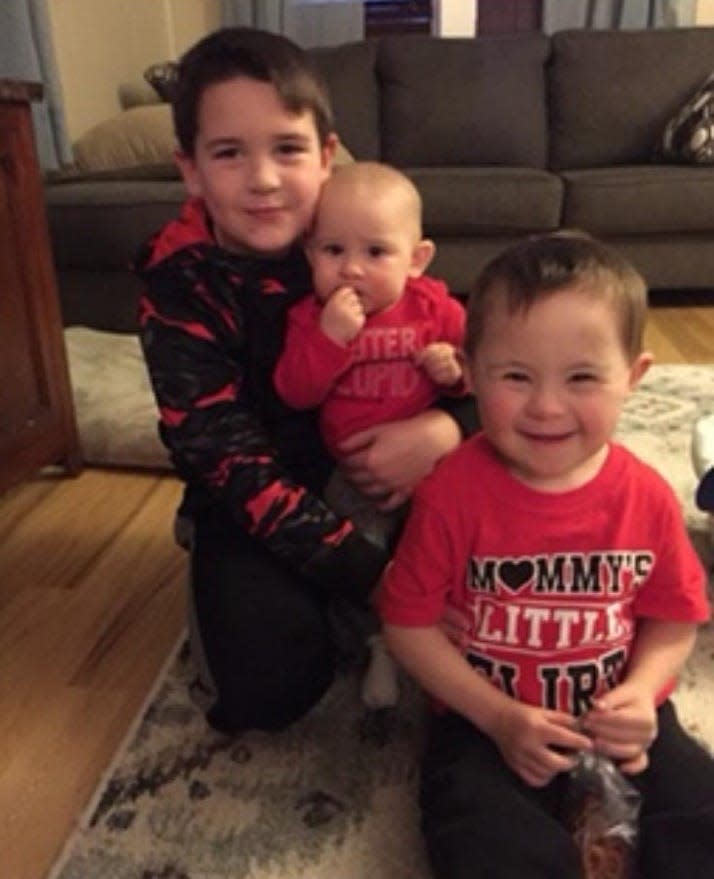 Cooper Busch with his big brother Cole and baby sister Hope.