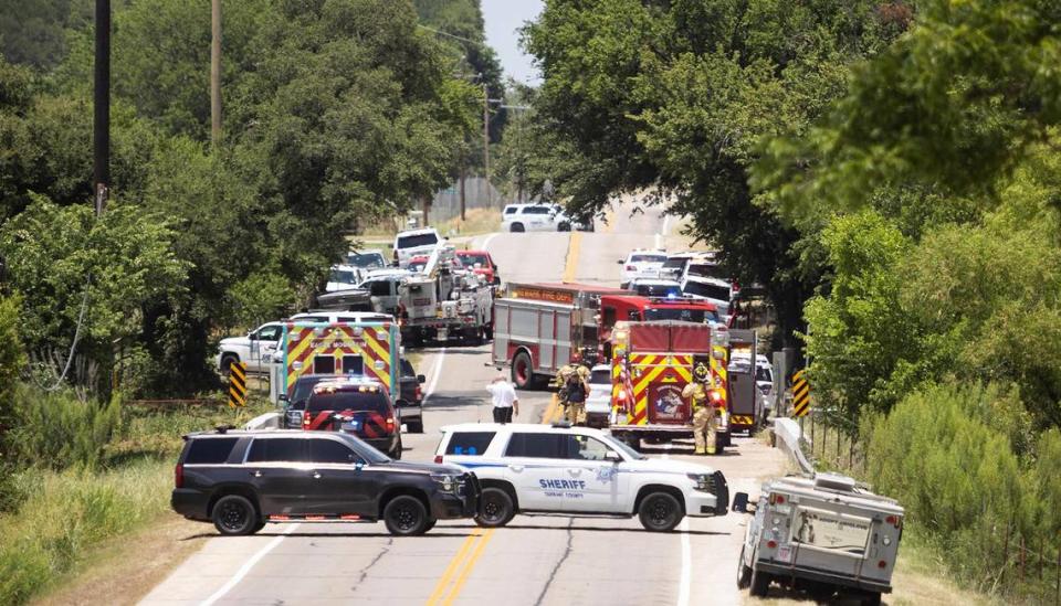 Law enforcement agencies, including Tarrant County Sheriff’s Office, block a section of Morris Dido Newark Road as they work an active scene nearby on Thursday, June 23, 2022. A suspect opened fire after deputies attempted to serve a felony warrant earlier in the morning.