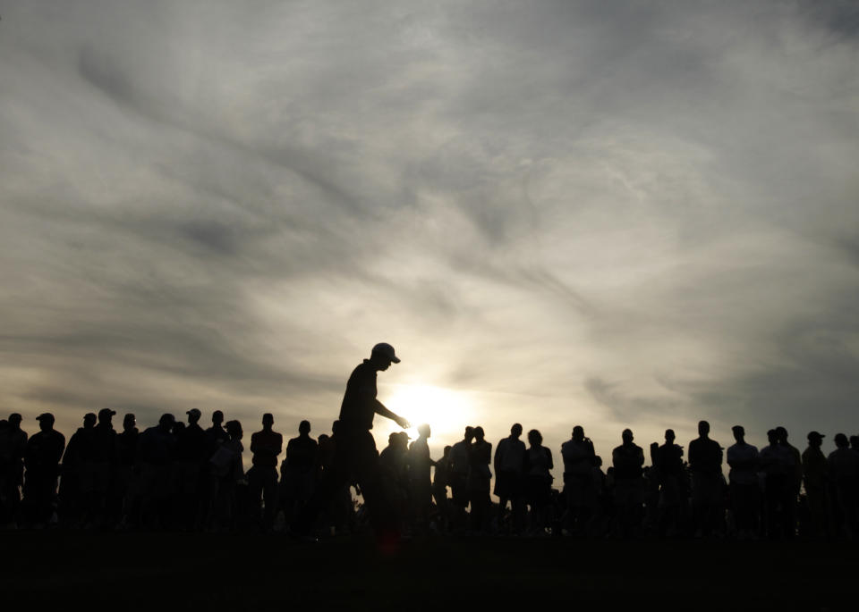 <p>Tiger Woods walks down the 18th fairway during the first round of the Masters golf tournament at the Augusta National Golf Club in Augusta, Ga., Thursday, April 9, 2009. Woods finished the round with a two-under par. (AP Photo/Charlie Riedel) </p>