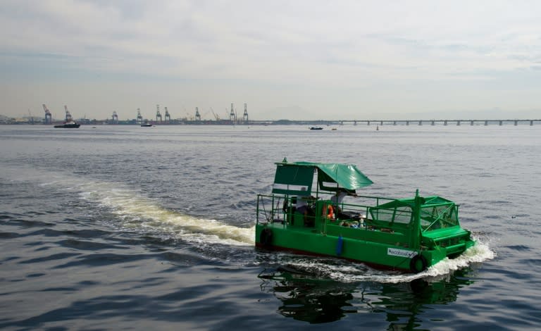 The cleaning vessel "Ecoboat" sails across the polluted waters of Guanabara Bay in Rio de Janeiro, Brazil