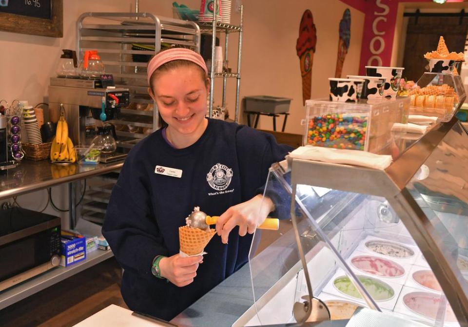 Cailee Sprouse makes an ice cream cone at Hub City Scoops in downtown Spartanburg, Wednesday, March 4, 2020. The ice cream shop is located at 158 E. Main St. [TIM KIMZEY/Spartanburg Herald-Journal]