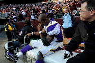 LANDOVER, MD - DECEMBER 24: Running back Adrian Peterson #28 of the Minnesota Vikings is helped off the field after being injured in the third quarter against the Washington Redskins at FedEx Field on December 24, 2011 in Landover, Maryland. (Photo by Patrick Smith/Getty Images)