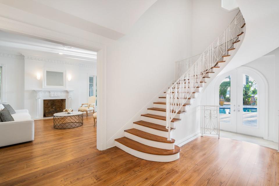 <p>A spiral staircase leads to the open-concept main floor.</p>