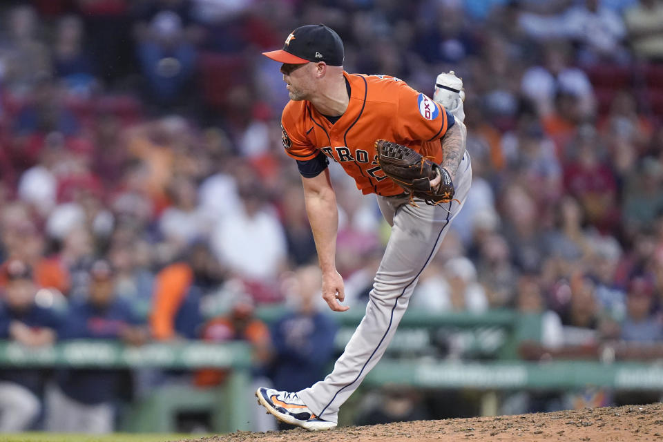 Houston Astros' Ryan Pressly follows through on a pitch to a Boston Red Sox batter during the ninth inning of a baseball game Wednesday, Aug. 30, 2023, in Boston. (AP Photo/Steven Senne)