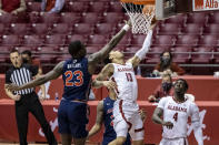 Alabama guard Jahvon Quinerly (13) gets past Auburn forward Jaylin Williams (23) for a basket during the second half of an NCAA college basketball game, Tuesday, March 2, 2021, in Tuscaloosa, Ala. (AP Photo/Vasha Hunt)