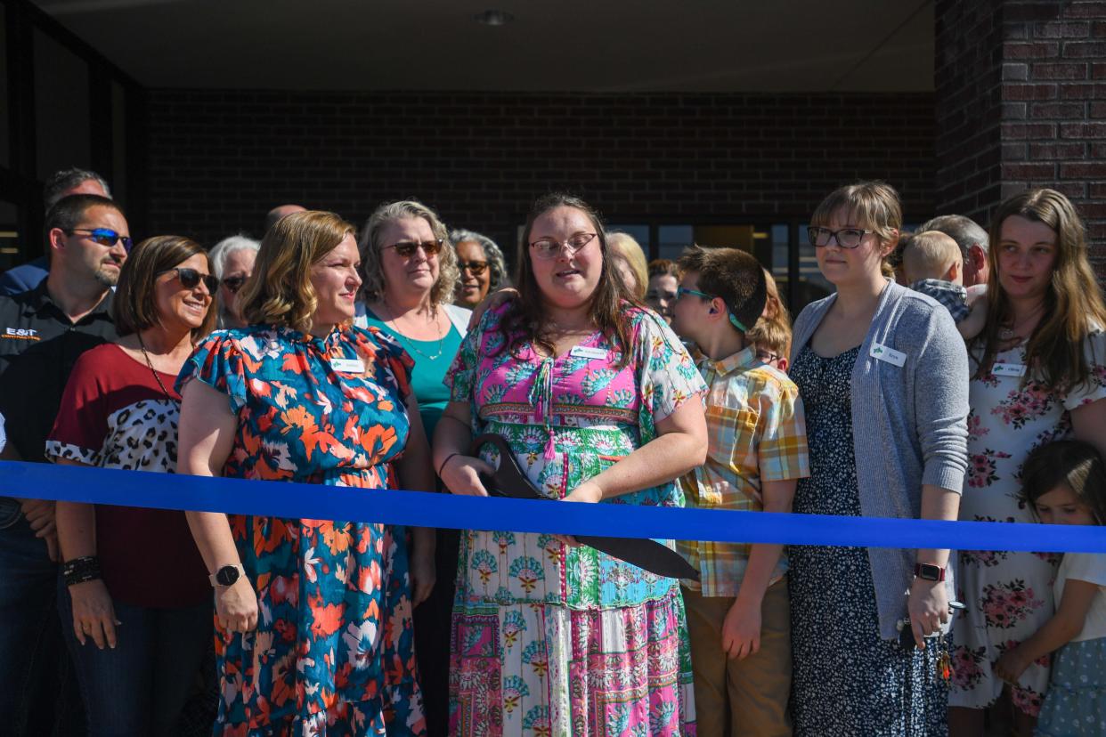Library Director Savannah Gilbert speaks as she gets ready to cut the ribbon during the Grand Re-Opening of Chester County Library in Henderson, Tenn., on Tuesday, April 30, 2024.