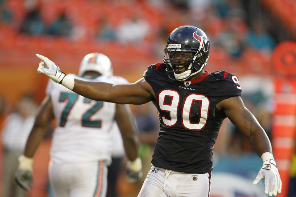 FILE - In this Sept. 18, 2011 file photo, Houston Texans' Mario Williams (90) reacts in the fourth quarter during an NFL football game against the Miami Dolphins in Miami. Former Texans star Mario Williams has been arrested on a misdemeanor charge for allegedly trespassing at a woman's Houston-area home. Harris County court records show Williams was arrested early Tuesday and freed on $100 bond. (AP Photo/Lynne Sladky, File)