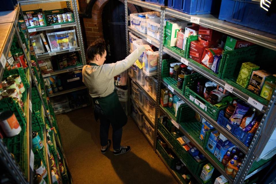 File photo: A volunteer at Wandsworth foodbank prepares food parcels for guests. (Getty Images)