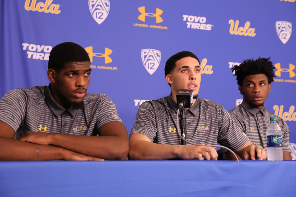 Cody Riley (left), LiAngelo Ball and Jalen Hill speak at a Nov. 15, 2017, press conference at UCLA after flying back from China. (Photo: Lucy Nicholson / Reuters)