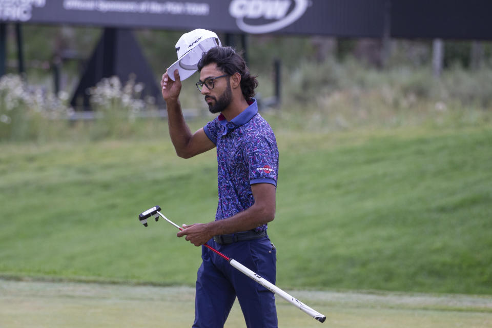 Akshay Bhatia tips his hat after winning the Barracuda Championship golf tournament at the Tahoe Mountain Club in Truckee, Calif., Sunday, July 23, 2023. (AP Photo/Tom R. Smedes)