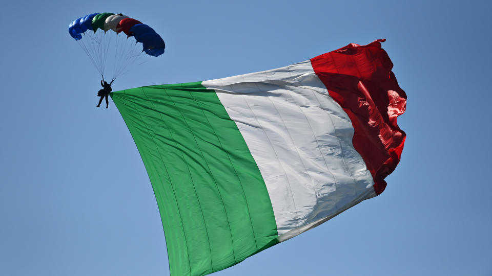 SCARPERIA, ITALY - SEPTEMBER 13: A parachutist flies with an Italian flag before the F1 Grand Prix of Tuscany at Mugello Circuit on September 13, 2020 in Scarperia, Italy. (Photo by Clive Mason - Formula 1/Formula 1 via Getty Images)