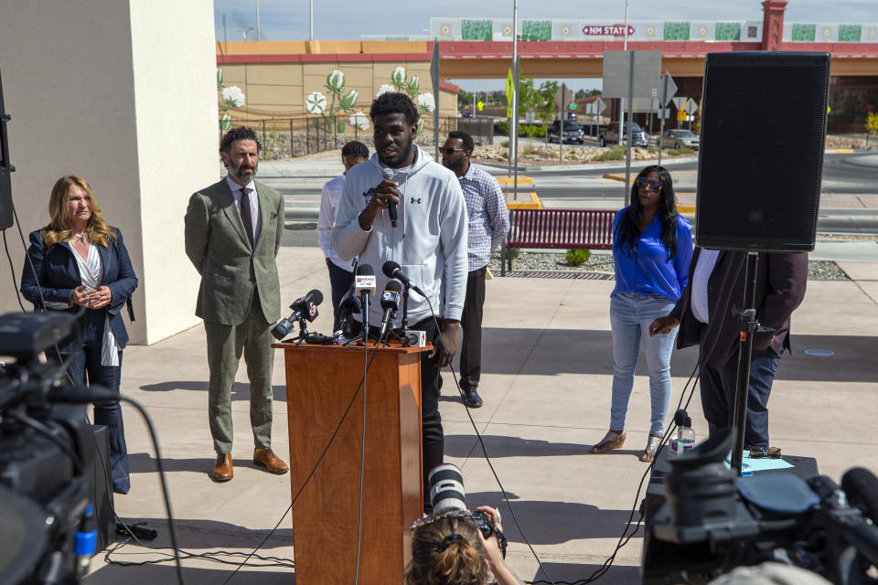 Former New Mexico State NCAA college basketball player Shak Odunewu, center, speaks at a news conference in Las Cruces, N.M., Wednesday, May 3, 2023. Odunewu and former Aggie player Deuce Benjamin discussed the lawsuit they filed alleging teammates ganged up and sexually assaulted them multiple times, while their coaches and others at the school didn't act when confronted with the allegations. (AP Photo/Andres Leighton)