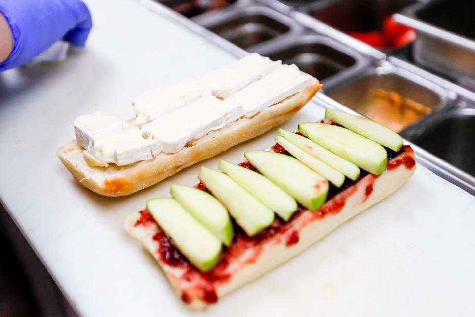 A Brie Apple Panini is made Oct. 10 by restaurant co-owner Emily Godfrey at Fox + Rye Sandwich Co. in Edmond.