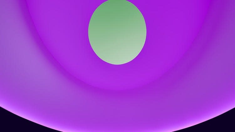 A view through the aperture in James Turrell’s “The Color Inside,” a permanent installation at UT. The color emitted by LED lights alters the color of the sky. In this case, pink light makes the sky appear pale green.