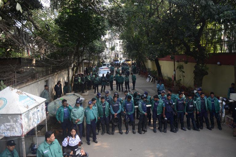 Bangladeshi police stand guard in front of the residence of main opposition Bangladesh Nationalist Party leader Khaleda Zia in Dhaka on December 30, 2013