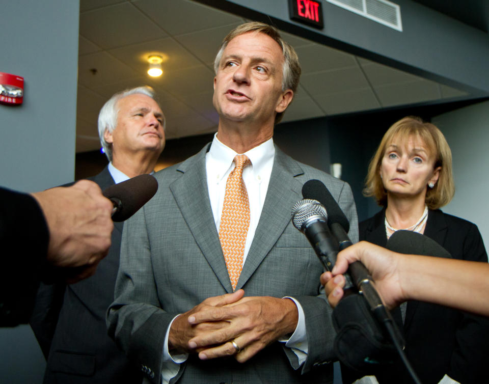 Gov. Bill Haslam speaks to reporters at the Adventure Science Center in Nashville, Tenn., on Tuesday, Sept. 18, 2012, following a ceremony to launch the state's new college savings plan. At rear are Senate Speaker Ron Ramsey, R-Blountville, and House Speaker Beth Harwell, R-Nashville. The governor said he approved Education Commissioner Kevin Huffman's decision to withhold $3.4 million in state funding from Nashville schools over a refusal to approve a charter school application. (AP Photo/Erik Schelzig)