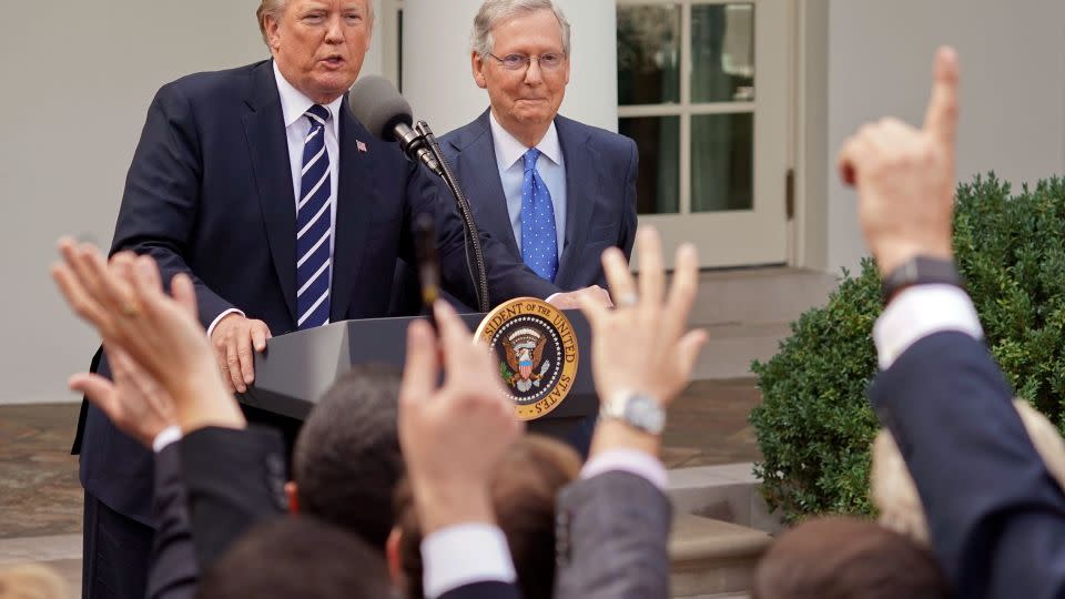 Journalist raise their hands as they wait to called on to ask a question to President Donald Trump and Senate Majority Leader Mitch McConnell in 2017. - Pablo Martinez Monsivais/AP