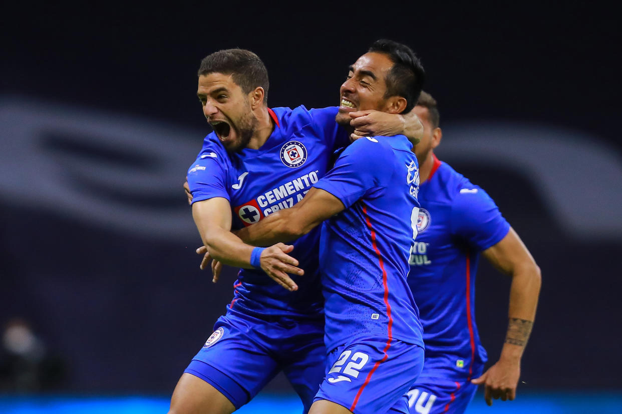 MEXICO CITY, MEXICO - DECEMBER 03: Rafael Baca #22 of Cruz Azul celebrates after scoring his team's second goal with José Rivero #15 of Cruz Azul during the semifinal first leg match between Cruz Azul and Pumas UNAM as part of the Torneo Guard1anes 2020 Liga MX at Azteca Stadium on December 03, 2020 in Mexico City, Mexico. (Photo by Manuel Velasquez/Getty Images)