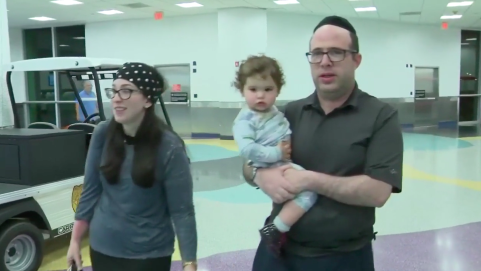 Jenni and Yossi Adler and their 19-mont-old daughter were kicked off the American Airlines flight. Source: WPLG