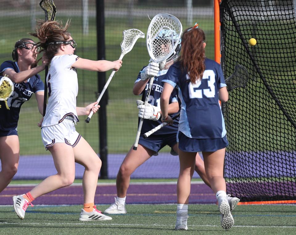 John Jay's Jo Jo Degl (6) fires a shot against Suffern during girls lacrosse action at John Jay High School in Cross River High  April 11, 2023. John Jay won the game 17-9.