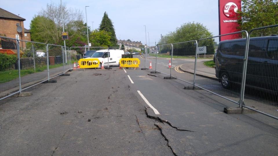 Bradford Telegraph and Argus: Part of Low Lane, in Horsforth is closed due to a burst water main, with the road heavily fractured
